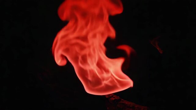 Fiery red inferno suspended mid-motion, filmed in wide macro Glowing embers and frozen waves of heat evoke surreal time-freeze intensity 4K