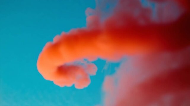 Expanding red smoke rings drifting across a black void, captured in macro rotation Soft volumetric lighting and smooth turbulence create a hypnotic rhythm 4K