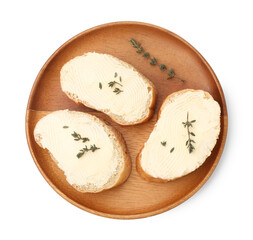 Slices of baguette with butter and thyme isolated on white, top view