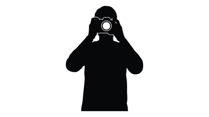 Silhouette of a photographer holding a camera up to their face