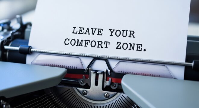 Typewriter message displaying leave your comfort zone concept, promoting growth, challenge and new opportunities