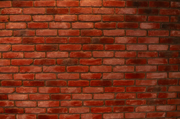 Fototapeta premium The red brick wall of the building