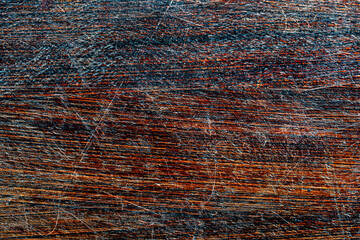 Background and texture of old scratched wood panel, closeup, top view. Wooden rough surface
