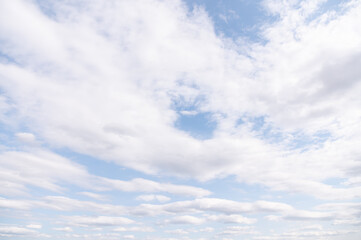 A blue sky with clouds on a sunny day