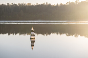 Conical black and white buoy © ROGANNA