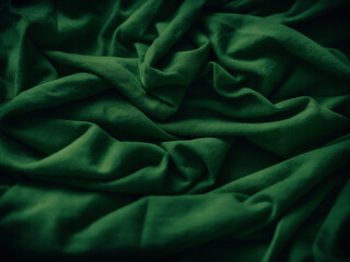 A crumpled green fabric background. Close up.