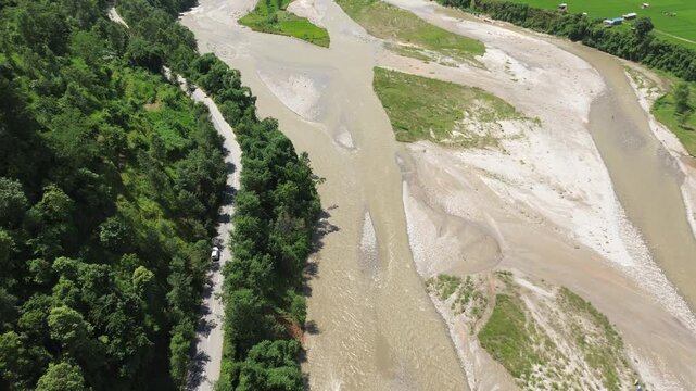 Aerial Drone View of Nuwakot Valley with a Beautiful River, Hills, Paddy Fields, and Scenic Road