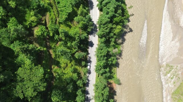 Aerial Drone View of Nuwakot Valley with a Beautiful River, Hills, Paddy Fields, and Scenic Road