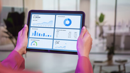 Business professional holding blank white tablet screen in modern office, mockup display for digital content, presentation concept, technology communication corporate branding clean interface