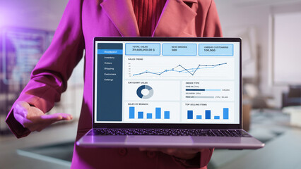 Business professional presenting blank laptop screen in modern office, mockup display for digital content, technology showcase corporate communication workspace background, clean interface copy space