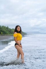 Close-up portrait of young Hispanic woman hugging tree trunk in nature