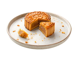 Traditional Chinese mooncake on ceramic plate with cut pieces and crumbs