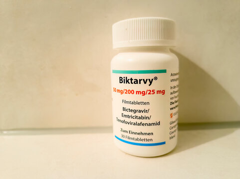 Ditzingen, Germany - December 20,2025: Downtown  This is a small, white bottle with 30 tablets of the antiretroviral HIV medication Biktarvy.