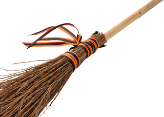 Halloween broom with orange and black ribbon decoration on white background