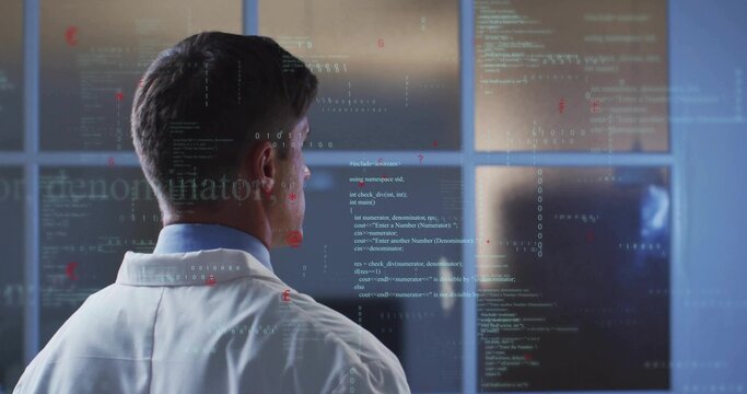 Analyzing researcher in lab coat in control-room viewing code on glass with monitors, copy space - Powered by Adobe