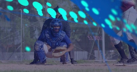 Crouching catcher receiving pitch at home plate, wearing full gear with mitt and ball