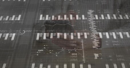 Displaying digital dashboard on office glass, showing charts and faint reflection in dark blazer