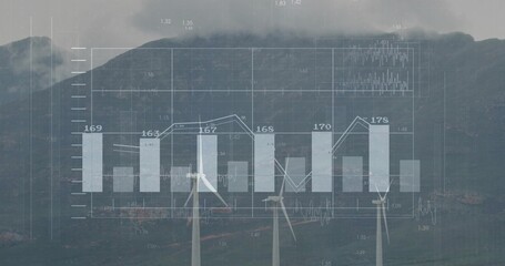 Displaying wind turbines and translucent charts over misty mountain ridge, showing numeric labels