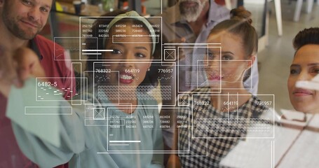 Pointing woman in blue blouse writing on glass board at office, with marker and digital overlays