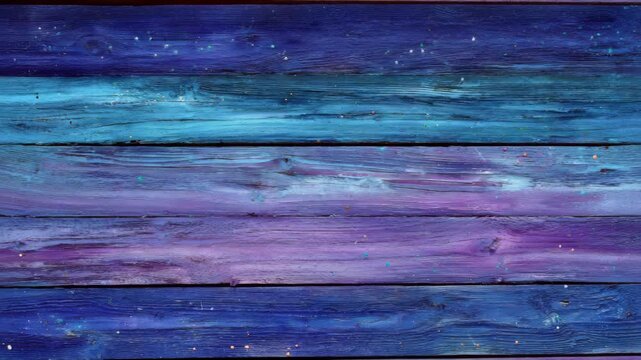 Vibrant blue and purple wooden planks with textured paint and specks