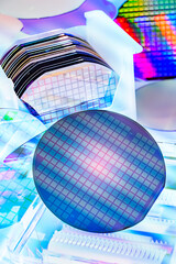 Silicon Wafers in white plastic holder box used in electronics for the fabrication of integrated circuits.