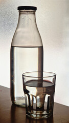 Glass bottle and drinking natural water refreshment