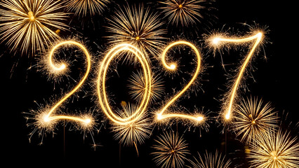 Sparkling fireworks display celebrating new year's eve 2027 with golden lights and vibrant colors