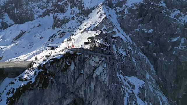 Drone Flight Over Zugspitze and Garmisch Alps in Winter, Snow Covered Peaks, Sunny Blue Sky, 4K