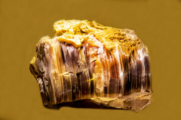 Anhydrite with shiny surfaces on a dark background. Gems, mineralogy, jewelry.