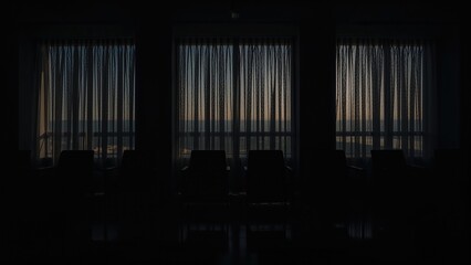 Fototapeta premium Room interior with large windows and curtains, viewed from inside at dusk or dawn. No additional objects or details visible.