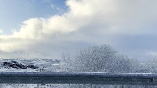 Winter landscape with patches of blue sky fro