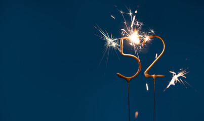 52 years celebration festive background made with Bengal fires in the form of number Fifty two.