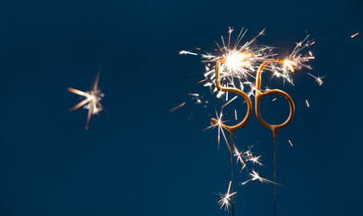 56 years anniversary celebration festive background made with Bengal fires in the form of number Fifty six.