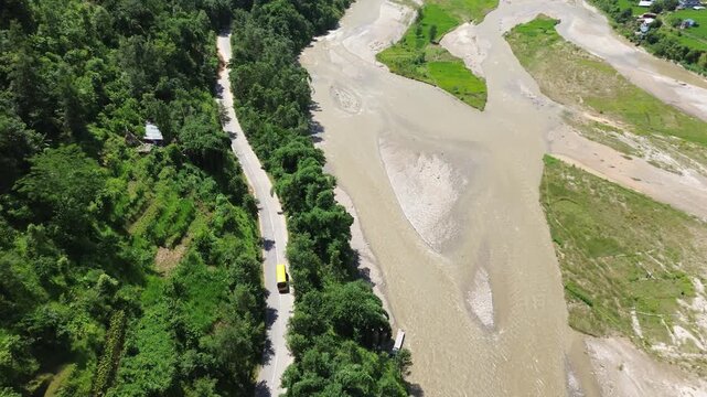 Aerial Drone View of Nuwakot Valley with a Beautiful River, Hills, Paddy Fields, and Scenic Road