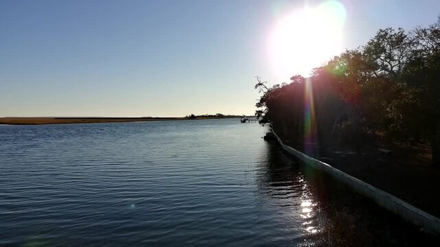 Drone clip of slow ascension over the intercostal waterway in South Carolina just before sunset.