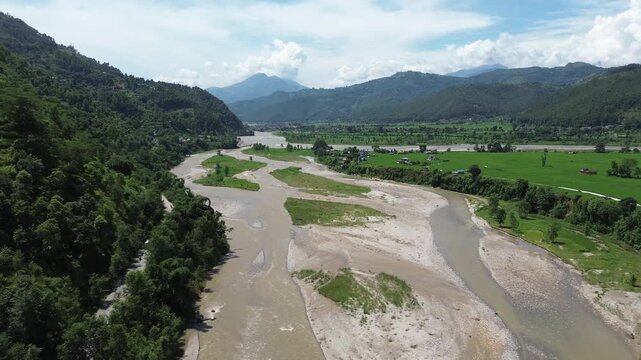 Aerial Drone View of Nuwakot Valley with a Beautiful River Flowing Along Hills and Paddy Fields