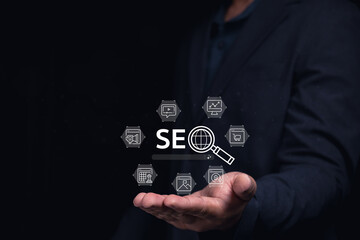 A person in a suit holding a hand out with SEO-related icons floating above, symbolizing digital marketing and search engine optimization.