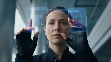 Focused Woman Interacting with Futuristic Holographic HUD Interface and High-Tech Digital Data Display - Powered by Adobe