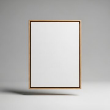 Empty floating wooden canvas frame mockup suspended against a soft grey background