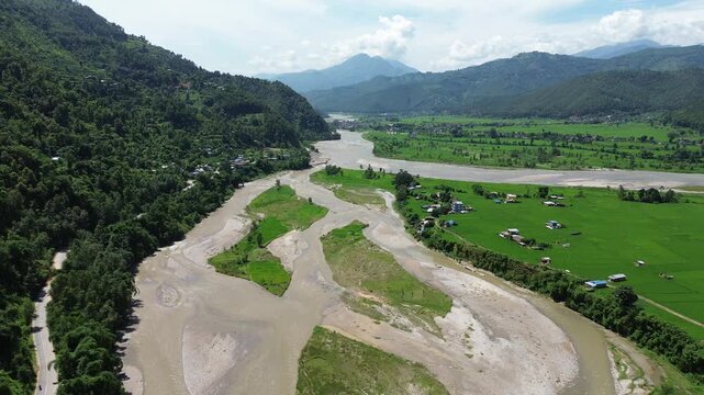 Aerial Drone View of Nuwakot Valley with a Beautiful River Flowing Along Hills and Paddy Fields