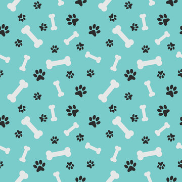 Blue pet seamless pattern with white dog bones and black paw prints for nursery