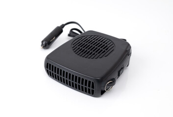 Compact black car heater powered by cigarette lighter, isolated on white background, portable automotive heating and defrost device.