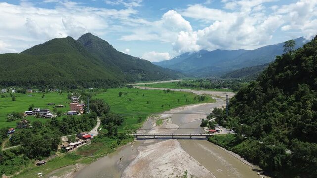 Aerial Drone View of Nuwakot Valley with a Beautiful River Flowing Along Hills and Paddy Fields