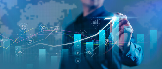 Businessman analyzing financial growth with futuristic bar charts, data analytics, and upward trends, symbolizing business success, digital finance, and investment strategy.
