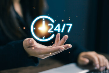A professional presenting a 24/7 service icon above a laptop, representing customer support, online assistance, continuous service availability, and modern customer experience solutions.