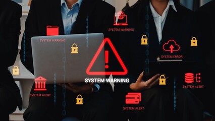 Business professionals working with laptops surrounded by system warning alerts and cybersecurity icons in a modern office environment Gluon.