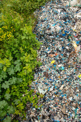 shredded and pressed recyclable plastic waste that has been burned and causes environmental pollution.