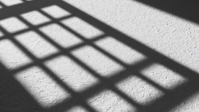 Abstract motion graphic animation of stylized window frame shadows seamlessly gliding and repeating across a flat textured white surface white background, subtle movement, design asset