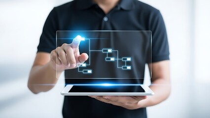 Man in black shirt interacting with futuristic digital interface on tablet