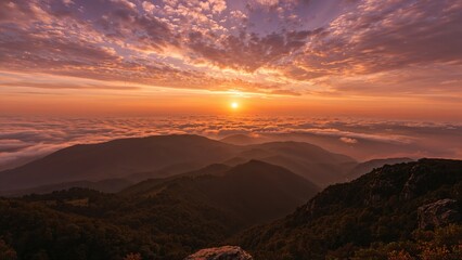 Sunset over mountain landscape, with vibrant sky and scattered clouds. Nature and outdoor scenery, peaceful and scenic view.